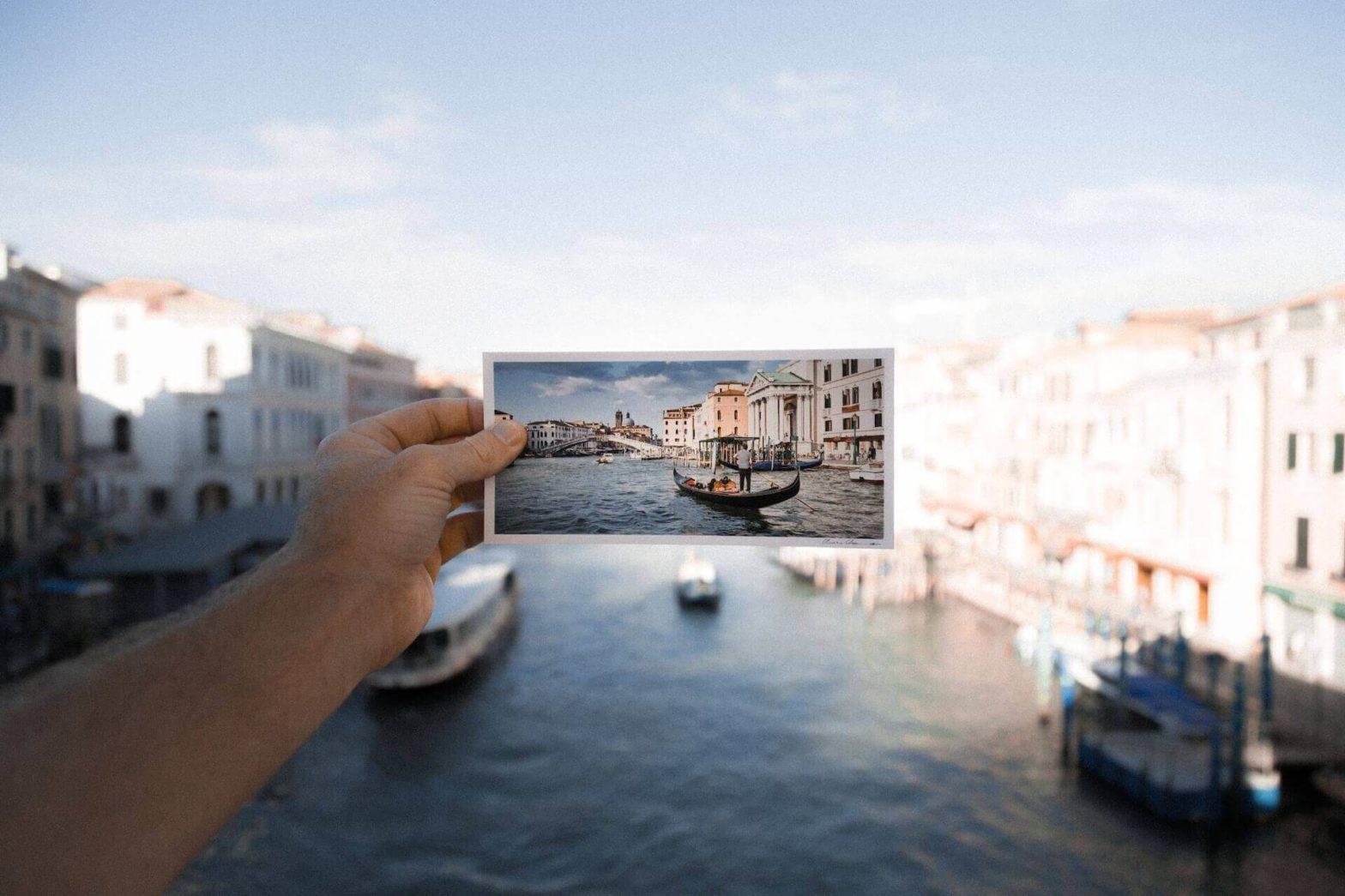 a photo of venice, italy being held up in the real venice, italy