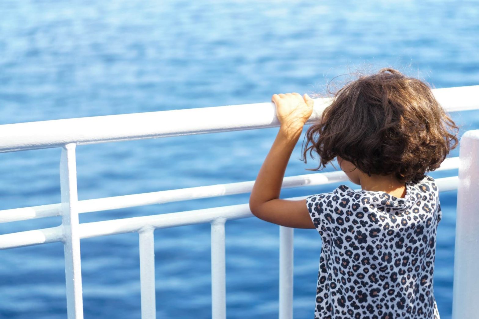 girl standing on ferry deck