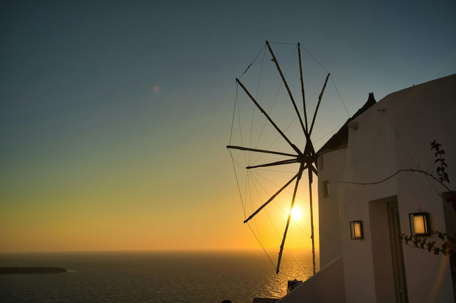 windmill at sunset on greek island